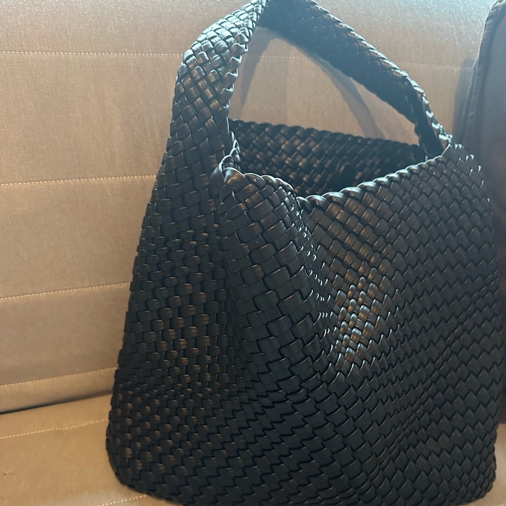 Vegan leather woven handbag.